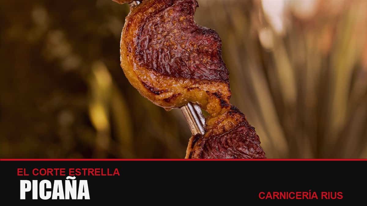 Picaña a la brasa en espetón, con su capa de grasa dorada